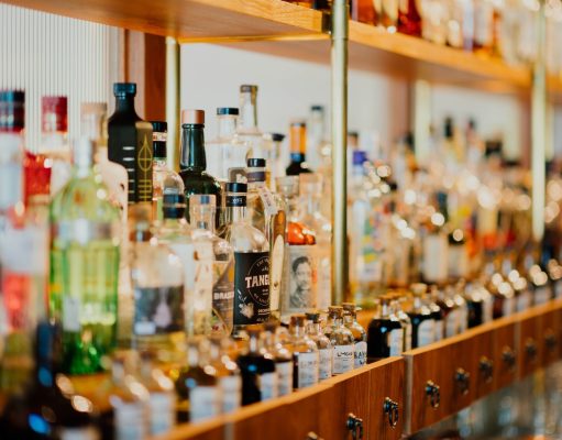 close-up photo of liquor bottles in rack