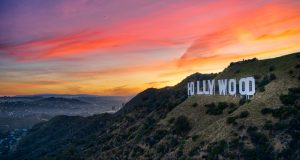 white concrete building on top of mountain during sunset