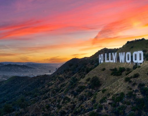 white concrete building on top of mountain during sunset