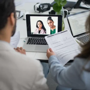 Young professional participant in a virtual job interview on computer screen, highlighting challenges of remote hiring processes