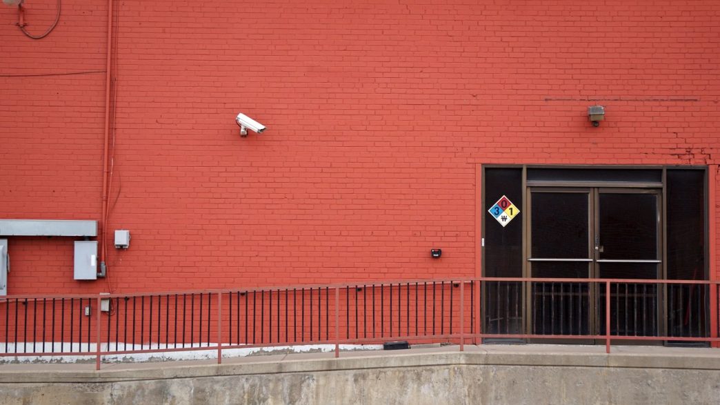 Security camera and rear entrance on a commercial building: Business Crime Outlook: Almost One UK Firm in Three Likely to Suffer an Offence Over the Current Year
