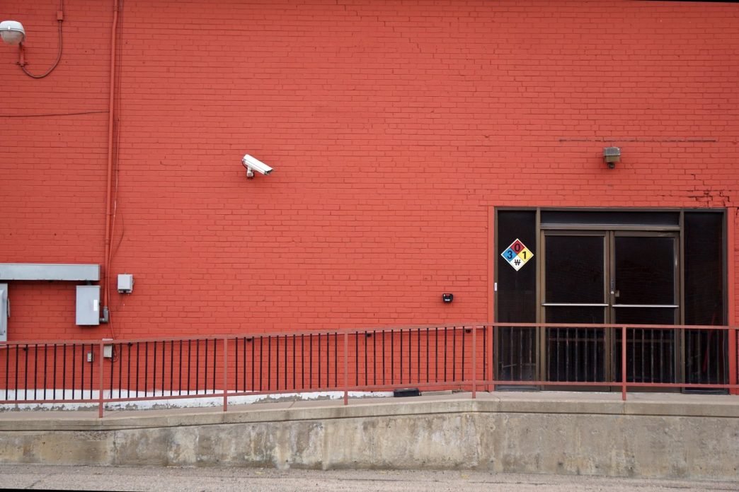 Security camera and rear entrance on a commercial building: Business Crime Outlook: Almost One UK Firm in Three Likely to Suffer an Offence Over the Current Year