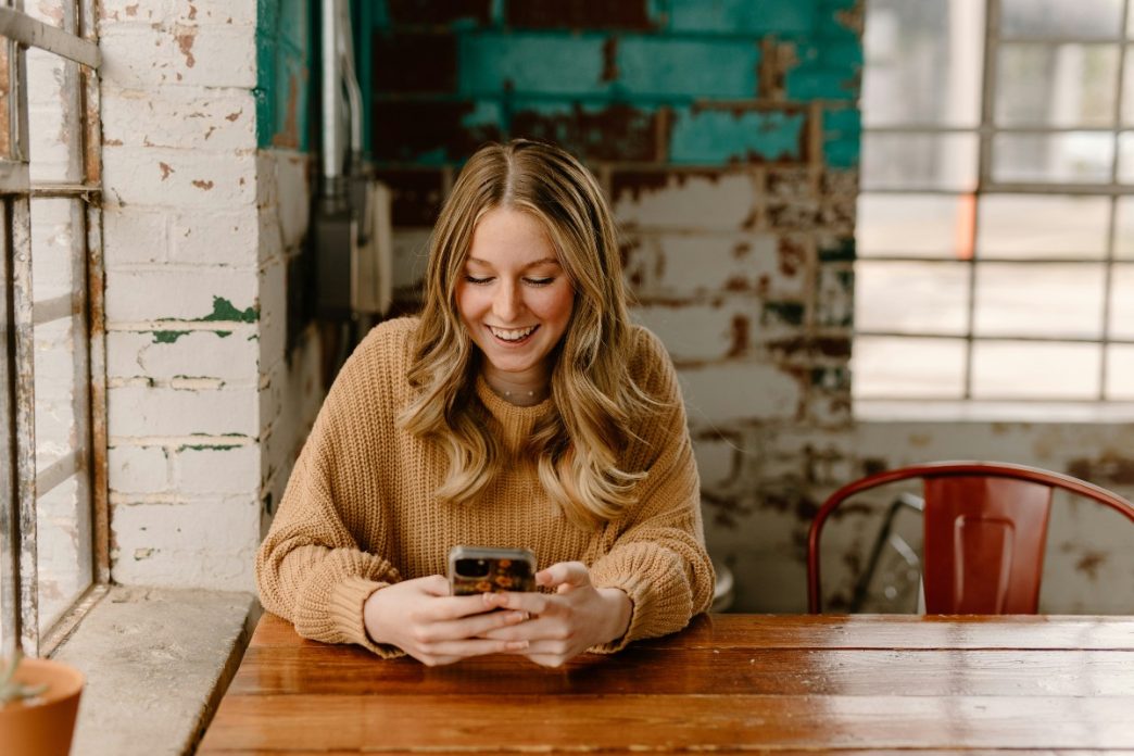 Borrower checking a loan account on a smartphone: Loan Approval Is Only the Start: Why Support Still Counts