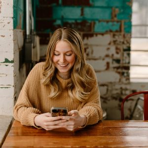 Borrower checking a loan account on a smartphone: Loan Approval Is Only the Start: Why Support Still Counts