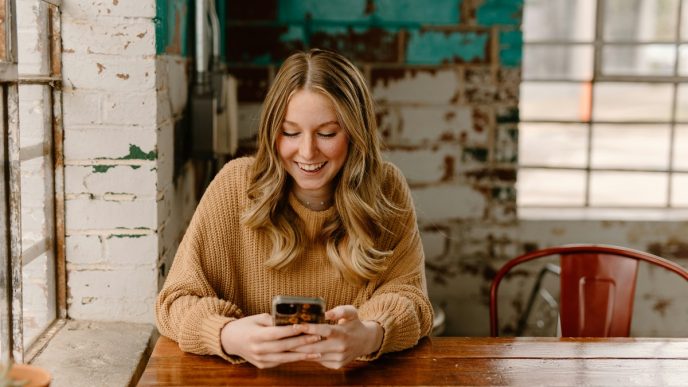 Borrower checking a loan account on a smartphone: Loan Approval Is Only the Start: Why Support Still Counts
