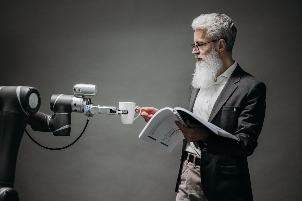 Researcher working with an AI robot assistant