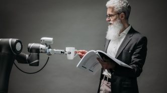 Researcher working with an AI robot assistant